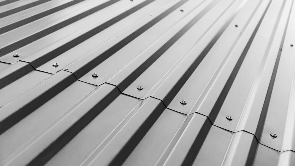 blue corrugated metal roof with rivets Aderhold Roofing