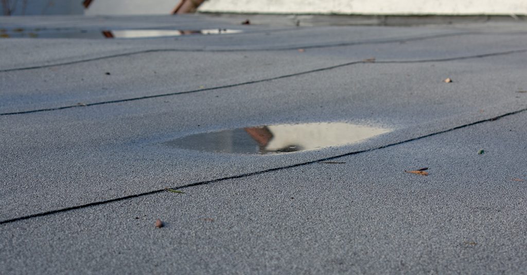 Common Causes of Commercial Roof Leaks Aderhold Roofing